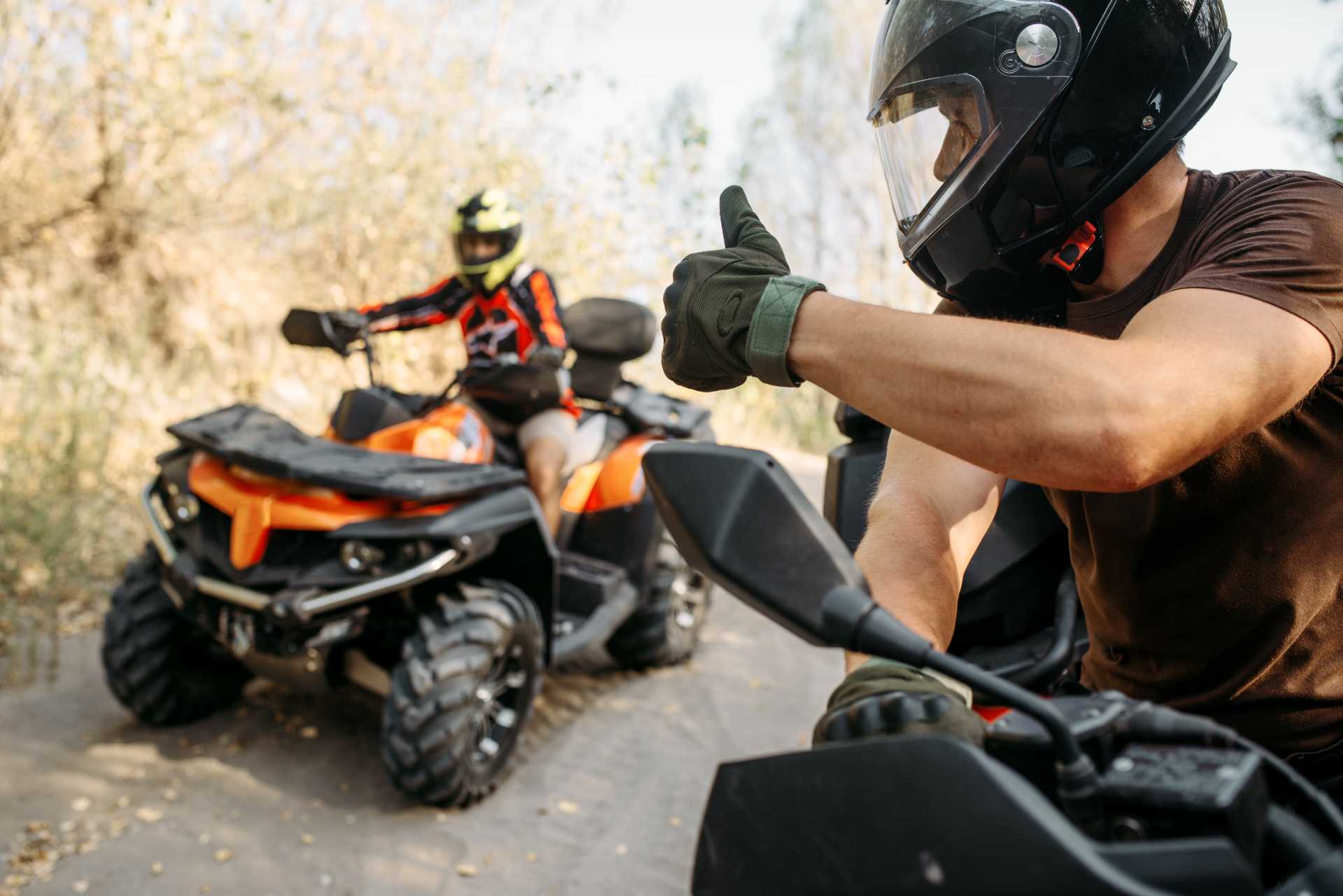 atv-rider-showing-thumbs-up-his-partner (1)